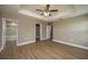 Bedroom featuring wood floors, walk-in closet and ensuite bathroom at 4189 Radford Rd, Bartow, FL 33830