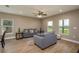 Cozy living area filled with natural light, featuring modern sofas, wood floors and neutral decor at 4189 Radford Rd, Bartow, FL 33830
