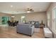 Comfortable living space connected to the dining area, featuring wood-look floors and neutral decor at 4189 Radford Rd, Bartow, FL 33830