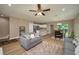 Spacious living room open to kitchen with hard surface floors, modern decor, and great natural light at 4189 Radford Rd, Bartow, FL 33830
