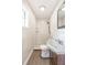 Bathroom featuring new walk-in shower, vanity, faucet, new tile, and wood-look floor at 4215 Sunnyside Dr, Lakeland, FL 33810