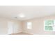 Light-filled bedroom with neutral walls, sleek flooring, and a cozy atmosphere at 4215 Sunnyside Dr, Lakeland, FL 33810