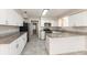 Modern kitchen with white cabinets, granite countertops, and stainless steel appliances at 4215 Sunnyside Dr, Lakeland, FL 33810