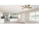 Open-concept living area flows into the kitchen, creating a spacious and inviting atmosphere at 4215 Sunnyside Dr, Lakeland, FL 33810