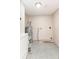 Utility room features a water heater, concrete floors, and paint buckets at 4215 Sunnyside Dr, Lakeland, FL 33810