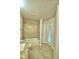 Bathroom featuring granite vanity, tiled shower-tub combination, and access to the patio at 4318 Juliana Lake Dr, Auburndale, FL 33823