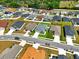 Aerial view of a residential neighborhood with manicured lawns and mature trees at 4412 Reding Way, Lakeland, FL 33813