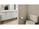Modern bathroom featuring double sinks, granite countertops and tile floors at 4412 Reding Way, Lakeland, FL 33813