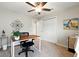 Cozy bedroom featuring neutral walls, carpet, ceiling fan, and a functional desk area at 4412 Reding Way, Lakeland, FL 33813