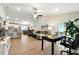 Open-concept living area with seamless transition to dining and kitchen spaces at 4412 Reding Way, Lakeland, FL 33813