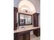 Elegant bathroom with a spacious vanity, framed mirror, and decorative chandelier lighting with dark wood finishes at 460 Canterwood Dr, Mulberry, FL 33860
