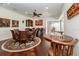 Open-concept dining area featuring a bar, table, and a chessboard, perfect for entertaining guests and playing games at 460 Canterwood Dr, Mulberry, FL 33860