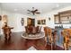 Open-concept dining area featuring a bar, table, chairs and a chessboard, perfect for entertaining guests at 460 Canterwood Dr, Mulberry, FL 33860