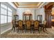 Formal dining room showcases a chandelier, custom cabinetry, and elegant seating for refined entertaining at 460 Canterwood Dr, Mulberry, FL 33860