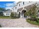 Elegant home with stone accents, manicured landscaping and a circular paver driveway at 460 Canterwood Dr, Mulberry, FL 33860