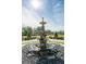 Close up of the fountain in the front yard with a horse statue at 460 Canterwood Dr, Mulberry, FL 33860