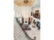 Grand foyer with a soaring ceiling, elegant chandelier, fireplace, and a curved staircase at 460 Canterwood Dr, Mulberry, FL 33860