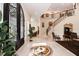 The grand foyer features marble floors, wrought iron staircase and large front door at 460 Canterwood Dr, Mulberry, FL 33860