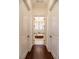 Hallway view of a large soaking tub with chandelier in a luxury bathroom at 460 Canterwood Dr, Mulberry, FL 33860