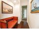 Hallway featuring wood floors, neutral paint, and nautical themed decorations at 460 Canterwood Dr, Mulberry, FL 33860