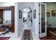 Grand hallway with arched doorways, marble floors, a decorative rug, and an elegant staircase at 460 Canterwood Dr, Mulberry, FL 33860
