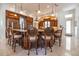 This kitchen features wooden cabinets, granite countertops, a central island, and pendant lighting at 460 Canterwood Dr, Mulberry, FL 33860