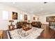 Comfortable living room featuring dark wood floors and stylish furniture, creating an inviting atmosphere at 460 Canterwood Dr, Mulberry, FL 33860