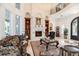Stately living room with fireplace, custom built-ins, and large windows, perfect for entertaining at 460 Canterwood Dr, Mulberry, FL 33860
