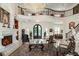 Spacious living room with a fireplace, elegant furnishings, and staircase with beautiful iron railings at 460 Canterwood Dr, Mulberry, FL 33860