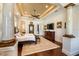 Open main bedroom featuring hard wood floors, decorative columns, and detailed ceiling at 460 Canterwood Dr, Mulberry, FL 33860