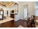 Open main bedroom with decorative columns, hardwood flooring, and a sitting area near the windows at 460 Canterwood Dr, Mulberry, FL 33860