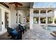 An expansive covered outdoor area with seating, a pool, and views of the landscaped yard offers resort-style living at 460 Canterwood Dr, Mulberry, FL 33860