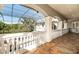 Outdoor patio with arches, decorative railing, screened ceiling and views of the landscape and pool at 460 Canterwood Dr, Mulberry, FL 33860