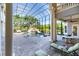 The screened-in pool area features a rock waterfall, lush landscaping, sun loungers, and ample space for relaxation at 460 Canterwood Dr, Mulberry, FL 33860