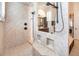 Modern tiled shower with dual showerheads and built-in shower caddy niches, designed with elegant neutral tones at 460 Canterwood Dr, Mulberry, FL 33860