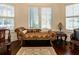 Sitting area features an ornate chaise lounge by a window with plantation shutters at 460 Canterwood Dr, Mulberry, FL 33860