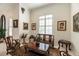 Cozy sitting room featuring unique furniture pieces, tasteful décor, and natural light through shuttered windows at 460 Canterwood Dr, Mulberry, FL 33860