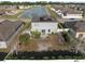 Aerial view of a home's backyard with a pond in the background at 4886 St James Ln, Winter Haven, FL 33881