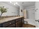 Bathroom featuring a granite vanity, bathtub with shower, and modern fixtures at 4886 St James Ln, Winter Haven, FL 33881