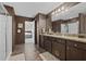 Bathroom featuring a double vanity, shower, and access to the main bedroom at 4886 St James Ln, Winter Haven, FL 33881