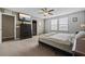 Relaxing bedroom with large window, ceiling fan, and en-suite bathroom at 4886 St James Ln, Winter Haven, FL 33881