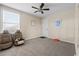 Spacious bedroom with ceiling fan, natural light, and minimalist decor at 4886 St James Ln, Winter Haven, FL 33881