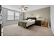 Comfortable bedroom featuring a ceiling fan, large window, and tasteful decorations at 4886 St James Ln, Winter Haven, FL 33881