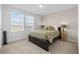 Inviting bedroom with natural light from two windows and a comfortable bed at 4886 St James Ln, Winter Haven, FL 33881