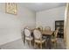 Well-lit dining area featuring modern table set against neutral walls, with complementary decor at 4886 St James Ln, Winter Haven, FL 33881