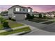 Beautiful two-story home with a two-car garage, a well-kept lawn, and lovely neighborhood views at 4886 St James Ln, Winter Haven, FL 33881