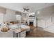 Cozy living area showcasing a fireplace, ceiling fan, stylish decor, and staircase access at 4886 St James Ln, Winter Haven, FL 33881