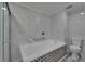 Elegant bathroom with soaking tub and tiled surround plus glass shower enclosure at 5015 Fox Cliff Dr, Lakeland, FL 33810