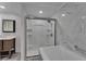 Elegant bathroom with a tiled shower, glass doors, and granite-topped vanity at 5015 Fox Cliff Dr, Lakeland, FL 33810