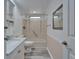 Bright bathroom featuring a tub and shower combination, vanity, and modern fixtures at 5015 Fox Cliff Dr, Lakeland, FL 33810